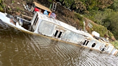 The fire-damaged barge