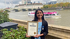 Hannah Miah is pictured with her award in central London