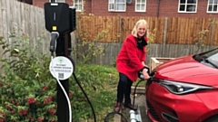 A customer charges her car at Crossley Community Centre