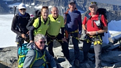 Pictured (left to right, standing) are: John Cooke, Judith Ireland, David Ireland, John Pollitt, Andrew Taylor and (kneeling) Janice Guest at the summit of Norway’s highest mountain