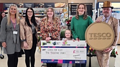 The cheque was presented at the Tesco store in Greenfield