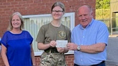 Councillors Dave Arnott and Christine Adams are pictured with one of the army cadets