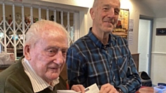 Clint Elliott, president of Saddleworth Rotary Club (right) presents a cheque to Dr Eamonn O’Daly