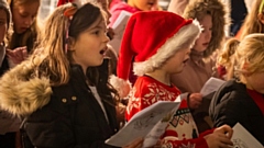 Local children from St Joseph’s RC Junior, Infant and Nursery School pictured during their musical performance at the Light Up a Life service