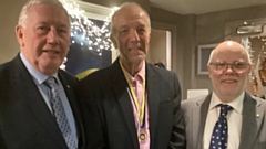 Immediate past chairman Jon Stocker, right, presented Clint with the Paul Harris insignia. Mr Ainley is on the left of the picture