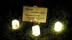 During the candlelit vigil, councillors and visitors believed they'd found a second plot on the other side of the cemetery, which may also contain a number of stillborn children