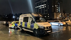 A riot van pictured outside last night's Oldham Council meeting