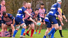 Oldham's Lewis Ward is pictured in the thick of the action. Image courtesy of Tim Abram