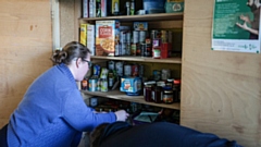 A volunteer at Wythenshawe Foodbank. Image courtesy of Kenny Brown / MEN