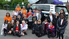 Pupils from the Oasis Academy in Hollinwood with the brand-new vehicle