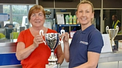 S & A contest organiser, Pam Bailey, receiving the new cup from one of the Dronsfields company’s directors, Angela Dronsfield