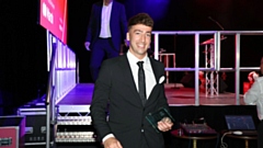 Kane Wallwork pictured with his award. Image courtesy of Avro FC