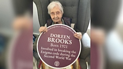 Doreen is pictured with her purple plaque