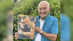 Tommy Cannon holding the pic of Robbie Williams - the night that changed his mindset