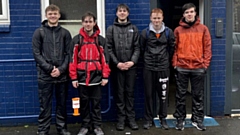 Sam Hollis and his pals pictured taking a break during their 32-mile fund-raising walk