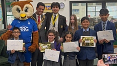 Mayor of Oldham, Cllr Zahid Chauhan, and Chaddy the Owl are pictured with the Winfield Literacy Award winners