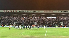 Latics players salute the hordes of travelling fans after last night's win at derby rivals Rochdale