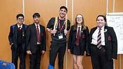 Josh Silver is pictured with a group of Radclyffe School pupils