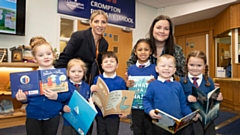 Bellway sales advisor Dawn (left) with headteacher Mrs Croston (right) and pupils from Crompton Primary